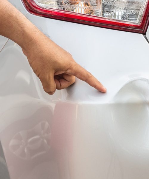 Backside of new silver car get damaged by accident